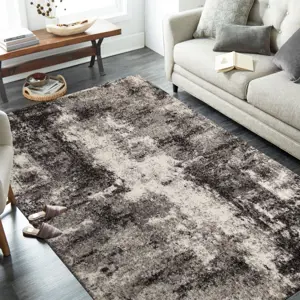 Produkt Brilatní béžově hnědý koberec s jemným abstraktním motivem